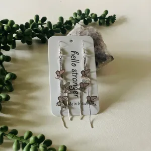 Y2K style butterfly waterfall earrings in silver // hello stranger